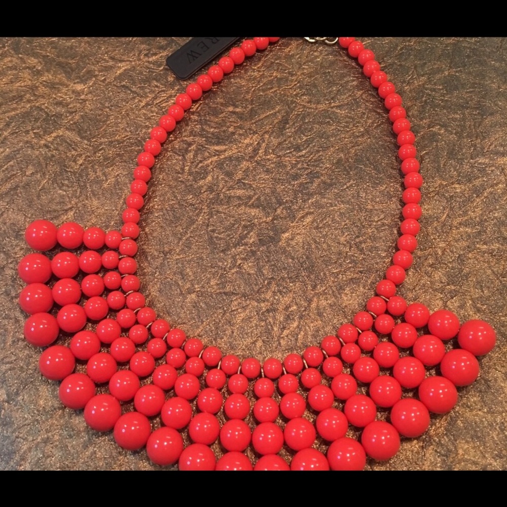 J Crew beaded statement necklace in coral color.